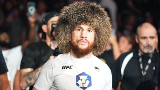 Merab Dvalishvili makes his walk for a UFC bantamweight fight.